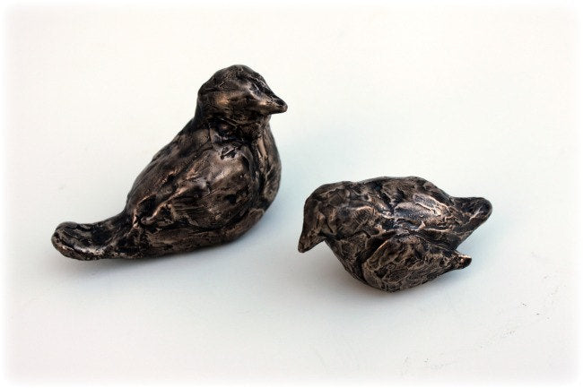 Small bronze bird sculptures