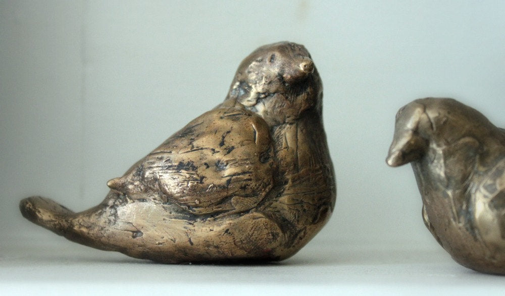 Small bronze bird sculptures