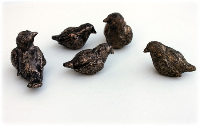 Small bronze bird sculptures